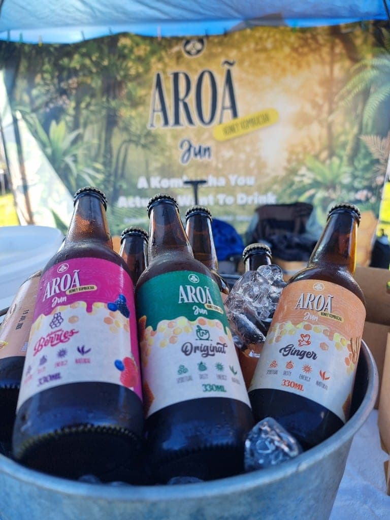 Original, Berries and Ginger Aroā Jun bottles chilling in an ice bucket